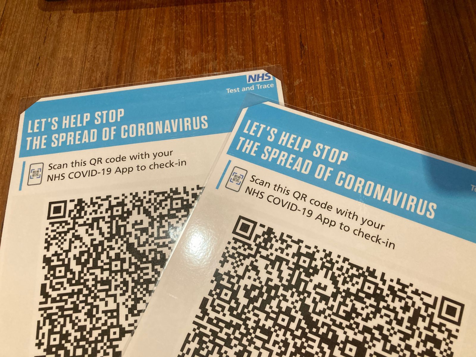 Cut the corners off the paper before laminating to give you somewhere to put the pin.